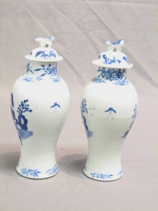 A pair of 19th Century Oriental porcelain urns and covers 9" (some damage)