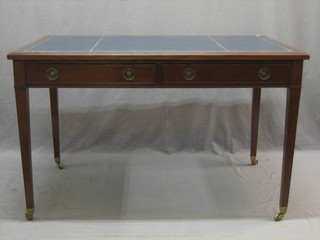 An Edwardian Georgian style mahogany library table with inset tooled leather writing surface above 2 long drawers, raised on square tapering supports ending in brass caps and castors 48"