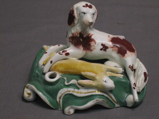 A Staffordshire pen rest in the form of a dog with dead hare 5"
