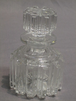 A circular cut glass perfume bottle and stopper 6"