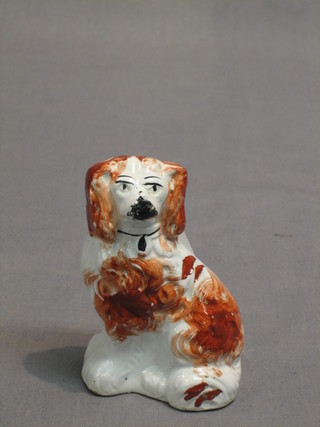 A 19th Century figure of a seated Staffordshire spaniel 3 1/2"