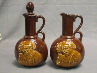 A pair of Hiawatha pottery flagons decorated Falstaffs 9"