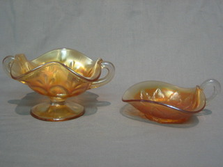 An orange Carnival glass twin handled bowl 5" and a leaf shaped dish 5"