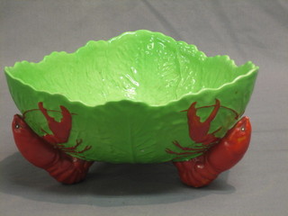 A triangular Carltonware leaf shaped dish raised on lobster supports 9"