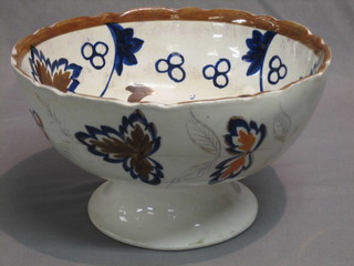 A Victorian pottery fruit bowl raised on a spreading foot 10" (cracked)