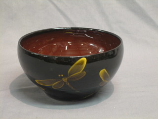 An Art Pottery bowl decorated a butterfly 8"