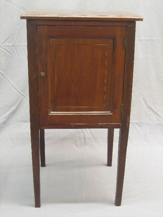 An Edwardian inlaid mahogany pot cupboard fitted a drawer and raised on square tapering supports 16"