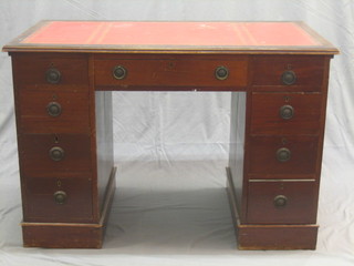 A 19th/20th Century mahogany kneehole pedestal desk with inset tooled leather writing surface, above 1 long and 8 short drawers 44"
