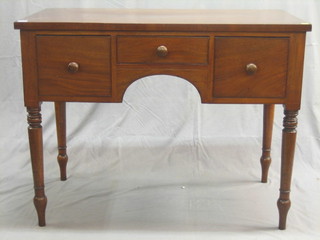 A Victorian mahogany sideboard fitted 1 long drawer flanked by 2 short drawers, raised on turned supports 41"