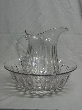 A cut glass water jug and bowl
