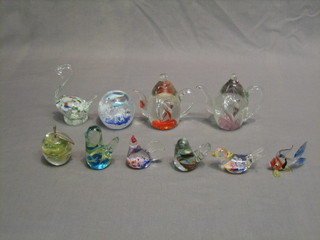 A collection of glass animals and paperweights 