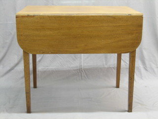 A 19th Century Pembroke table fitted a drawer, raised on square tapering supports 33"