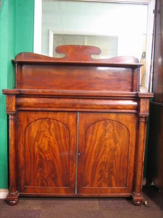 A 19th Century mahogany chiffonier with raised shaped back, the base fitted 1 long drawer above a cupboard enclosed by arch shaped panelled doors flanked by a pair of columns 48"