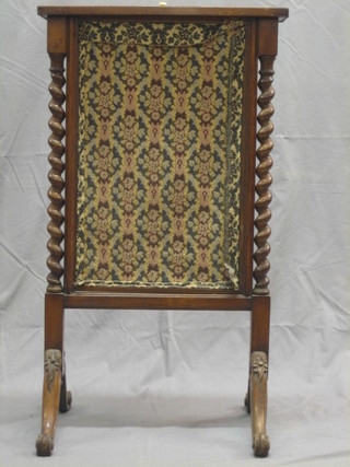 A Victorian walnut fire screen with spiral turned columns to the sides