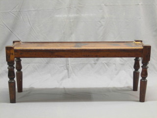 A 19th Century rectangular mahogany hall bench raised on turned supports 35"