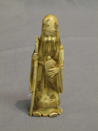 A carved ivory figure of a sage with turtle 5"