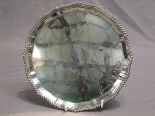 A silver salver with bracketed border, Sheffield 1944 by Walker & Hall 8", 10 ozs