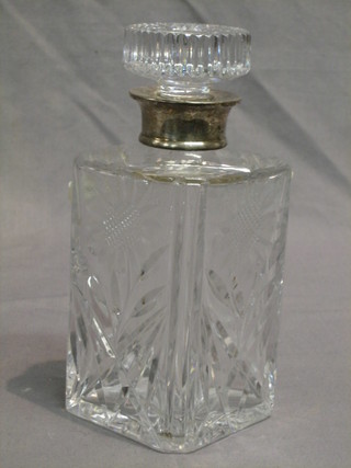 A square cut glass spirit decanter with silver collar