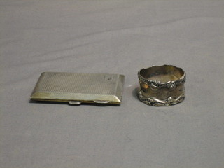 A silver cigarette case with engine turned decoration Birmingham 1926 and a silver napkin ring 3 ozs