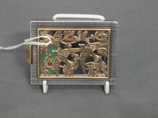 A  silver compact with  pierced gold grill, decorated birds amidst branches set 4 hardstones (1 missing) by Boucheron of London, cased numbered 7029/19 (glass on compact cracked) 3"