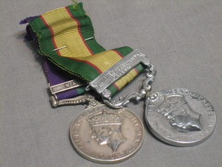 The India General Service medal 1936-39, 1 bar North West Frontier 1936-37 Calcutta Mint issue, name erased together with The Army RAF General Service medal 1918 1962, 1 bar Malaya