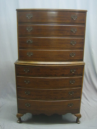 A 1940's Georgian style mahogany bow front chest on chest, the upper section fitted 4 long drawers, the base fitted 4 long drawers, with brass swan neck handles, raised on cabriole supports 30"