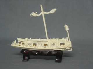 An Eastern carved ivory model of a Dow 7"