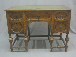 A  Jacobean style oak writing table with inset tooled green writing surface above 1 long and 2 short drawers, raised on bulbous turned supports 42"