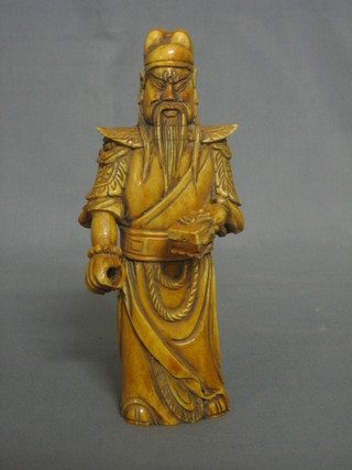 An Eastern carved ivory figure of a standing sage 8"