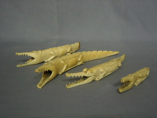 4 carved ivory figures of crocodiles 9" (some damage)