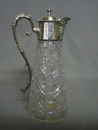 A Victorian cut glass claret jug with silver plated mount