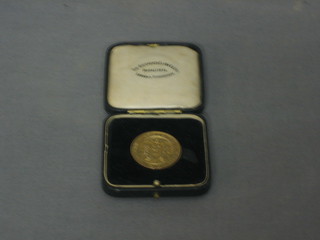 A 9ct gold London Athletics club medallion