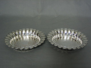A pair of circular silver plated dishes with fluted borders and engraved decoration 7"