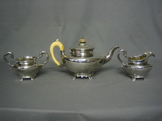 A Victorian silver 3 piece tea service of melon form comprising teapot, twin handled sugar bowl and cream jug, all raised on panelled supports, London 1845, 35 ozs