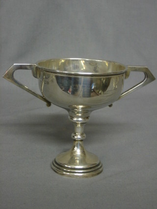 An  engraved silver twin handled trophy cup, Birmingham 1932 6 ozs