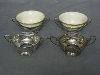 A set of 7 pierced Sterling silver soup bowl holders, 8 ozs, (5 with porcelain bowls)