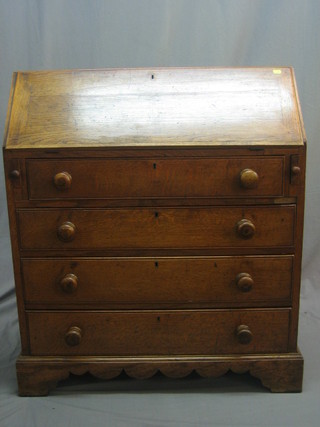 A 19th Century honey oak bureau with fall front revealing a well fitted interior above 4 long drawers, raised on bracket feet 35"