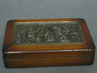 A Dutch cigar box with hinged lid decorated a metal panel depicting an interior feast scene 9"