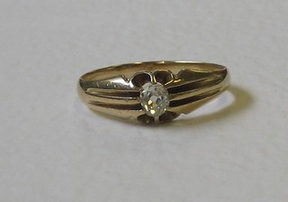 An 18ct gold gypsy ring set a diamond