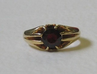 An 18ct gold dress ring set an amber coloured stone