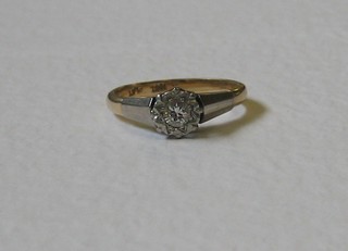 A lady's 18ct gold dress ring set an illusion cut diamond