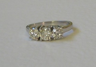 A lady's 18ct white gold engagement/dress ring set 3 diamonds (approx 1.50ct)