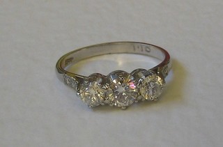 A lady's 18ct white gold engagement/dress ring set 3 diamonds and 6 diamonds to the shoulders (approx 1.05ct)