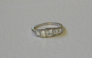 A lady's attractive 18ct white gold engagement/dress ring set 5 square cut diamonds (approx 1.70ct)