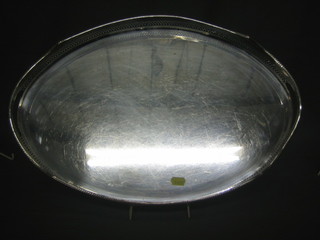 A pierced oval silver plated twin handled tea tray 20"