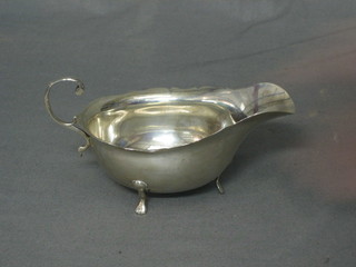 A Georgian style silver sauce boat with C scroll handle by Mappin & Webb, London 1906 3 ozs