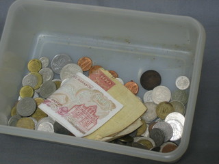 A quantity of various coins and paper money