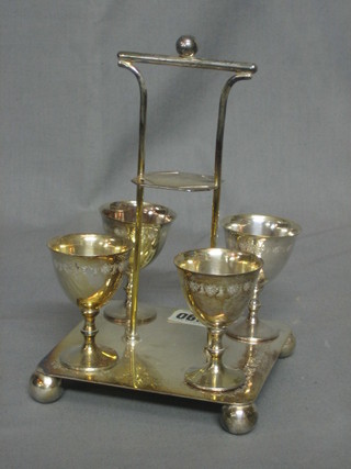 A silver plated 4 piece egg cruet