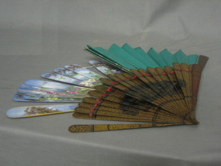 An Eastern lacquered fan and 2 other fans (f)