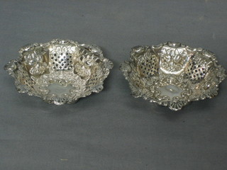 A pair of Edwardian pierced silver bon bon dishes 3 1/2" (some tears and dents)